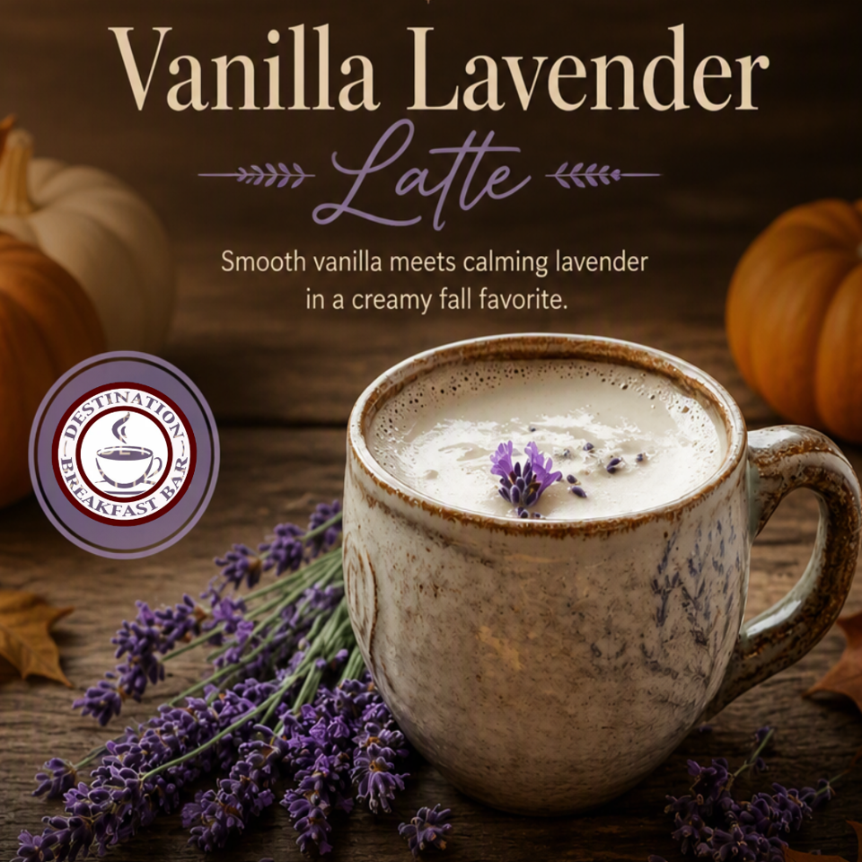 Vanilla lavender latte in a rustic ceramic mug garnished with lavender, surrounded by pumpkins and autumn décor.