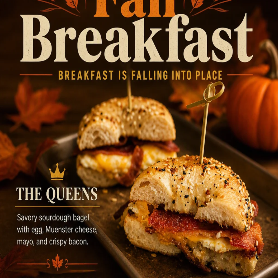 Promotional graphic featuring two savory sourdough bagel sandwiches with egg, Muenster cheese, mayonnaise, and crispy bacon, surrounded by autumn leaves and pumpkins.