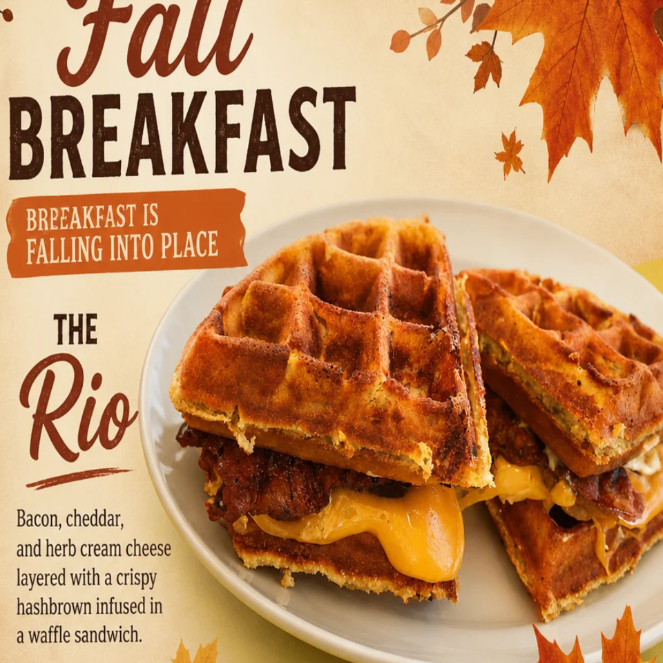 Fall breakfast advertisement featuring a waffle sandwich layered with bacon, cheddar, herb cream cheese, and crispy hash browns.